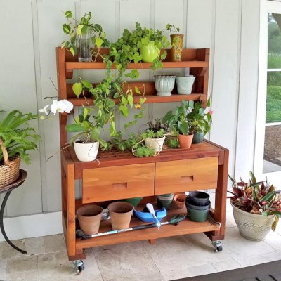 Eli's Redwood Potting Bench (Options: Large Size, Mature Redwood, With Casters, 2 Shelves, No Fold Down Sides, Copper Inset for Left Drawer, No Engraving, Removable Slatted Lid Over Left Drawer, Transparent Premium Sealant). Photo Courtesy of William Thomas Skywark of Saint Simons Island, Georgia.